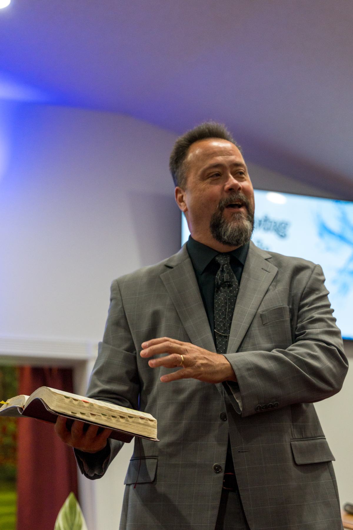 Pastor Gary preaching from the Bible